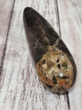 Closeup of a natural hand carved gemstone mineral pestle