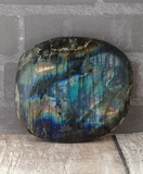 Iridescent gemstone gallet on wood grain background Labradorite from Madagascar GGandJ.com
