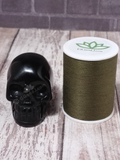 Obsidian Gemstone skull with thread spool size reference