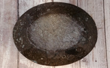 backside of oval fossil plate