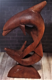 Dolphin duo carved from wood
