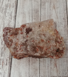 Clear quartz matrix underneath Hematite