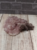 Cobalto Calcite from Morocco on wood grain background