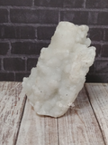 Chalcedony on wood grain and brick background