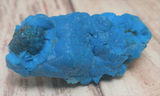 blue Chrysocolla on wood grain background