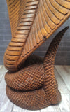 Close up of coil base on hand carved Indonesian Wood Cobra from Gypsy Gems & Jewelry