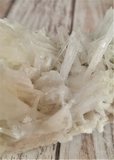 Scolecite Mineral from India on GGandJ.com Natural white spiky gemstone