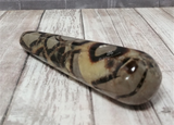 Natural Yellow Gray and Brown Gemstone Wand on Wood grain background